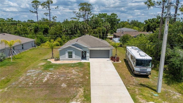 view of front of property featuring concrete driveway, an attached garage, and stucco siding