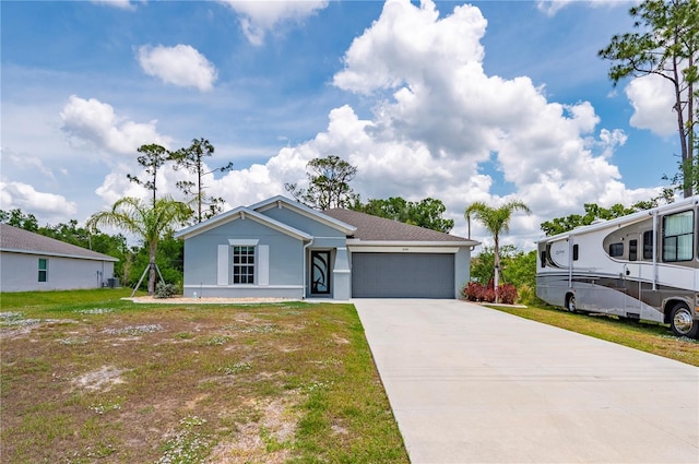 view of front of property with an attached garage, stucco siding, concrete driveway, and a front yard