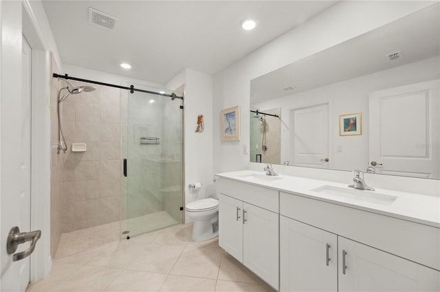 full bath featuring a stall shower, toilet, tile patterned flooring, double vanity, and recessed lighting