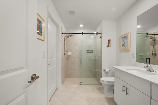bathroom with a stall shower, tile patterned flooring, vanity, toilet, and recessed lighting