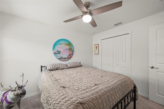 bedroom featuring light colored carpet, baseboards, a closet, and a ceiling fan