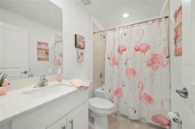 bathroom featuring tile patterned floors, toilet, vanity, shower / bath combo, and recessed lighting