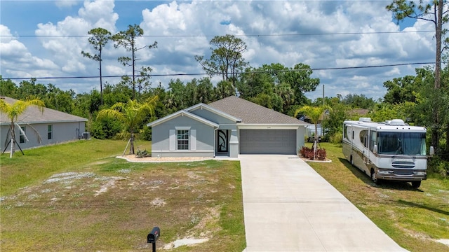 view of front of house featuring a garage, a front yard, concrete driveway, and stucco siding