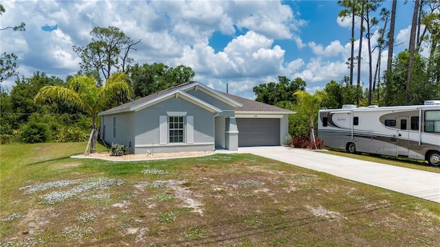 single story home featuring stucco siding, an attached garage, driveway, and a front lawn
