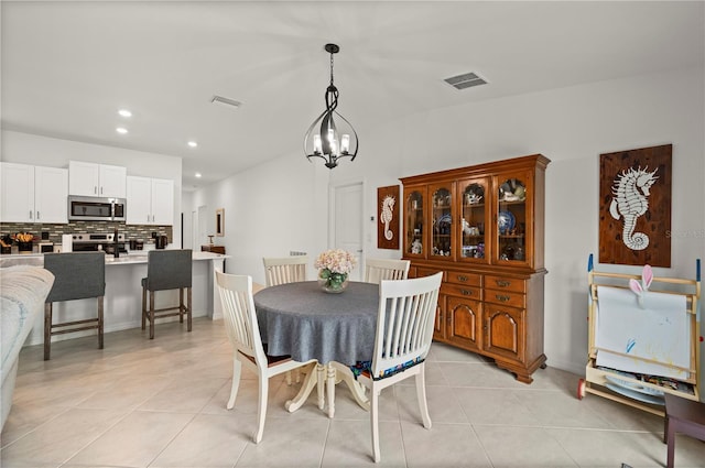 21310 Quesada Ave, Port Charlotte, FL 33952 - dining area with recessed lighting, a chandelier, and light tile patterned floors