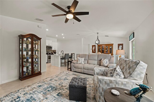 21310 Quesada Ave, Port Charlotte, FL 33952 - living area featuring ceiling fan, light tile patterned floors, lofted ceiling, and recessed lighting
