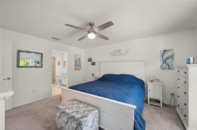 21310 Quesada Ave, Port Charlotte, FL 33952 - bedroom with light carpet, connected bathroom, and a ceiling fan