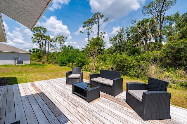 21310 Quesada Ave, Port Charlotte, FL 33952 - wooden deck featuring an outdoor hangout area, a yard, and view of wooded area