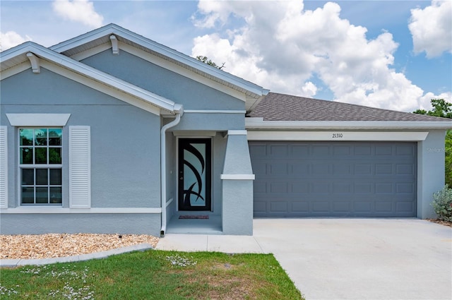 21310 Quesada Ave, Port Charlotte, FL 33952 - single story home with a garage, stucco siding, concrete driveway, and roof with shingles