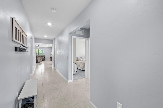 16016 Shoebutton Ct, North Fort Myers, FL 33917 - hall with light tile patterned flooring, baseboards, visible vents, and recessed lighting