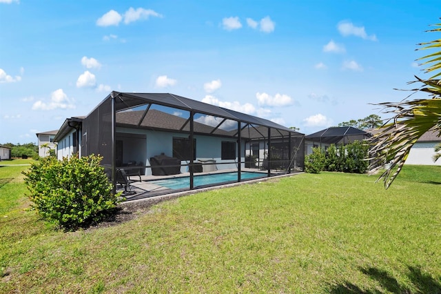16016 Shoebutton Ct, North Fort Myers, FL 33917 - back of house featuring a patio, an outdoor pool, and a yard