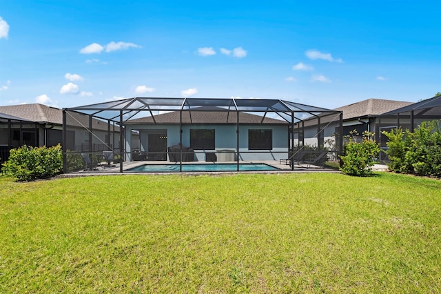 16016 Shoebutton Ct, North Fort Myers, FL 33917 - back of property featuring a yard, a patio, and an outdoor pool