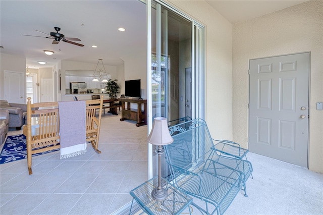 view of patio featuring ceiling fan