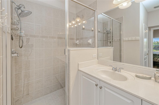 full bath with a shower stall and vanity