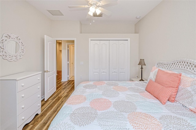 bedroom with light wood finished floors, a closet, and ceiling fan