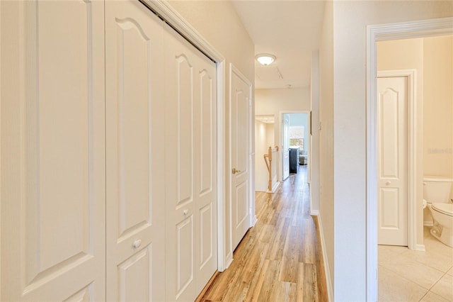 corridor with light wood-style floors