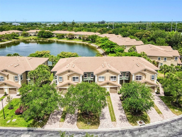 aerial view of residential area featuring a nearby body of water