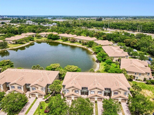 aerial perspective of suburban area with a nearby body of water