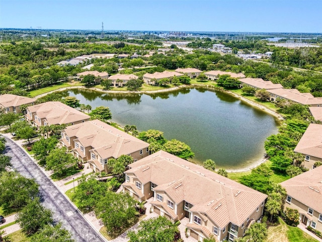 aerial perspective of suburban area with a large body of water