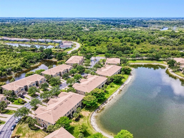 aerial perspective of suburban area with a large body of water