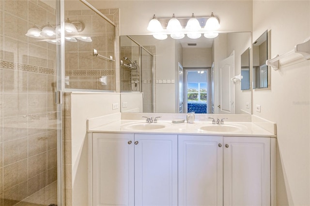 full bath with a shower stall and double vanity