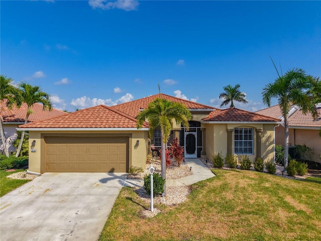 mediterranean / spanish-style home with stucco siding, a front lawn, a garage, concrete driveway, and a tiled roof