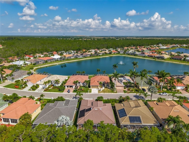 aerial view of residential area featuring a nearby body of water