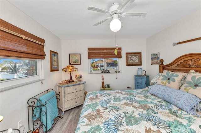bedroom featuring wood finished floors and a ceiling fan