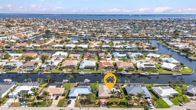 view of property location with nearby suburban area and a large body of water