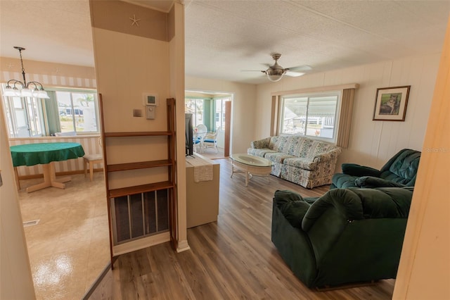 643 Blackburn Blvd, North Port, FL 34287 - living area with a ceiling fan, wood finished floors, and a chandelier