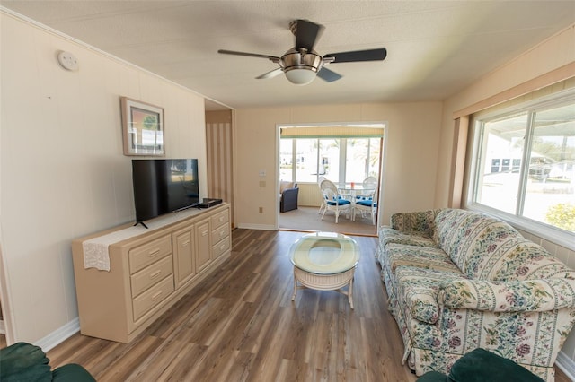 643 Blackburn Blvd, North Port, FL 34287 - living room with wood finished floors, a ceiling fan, ornamental molding, and baseboards