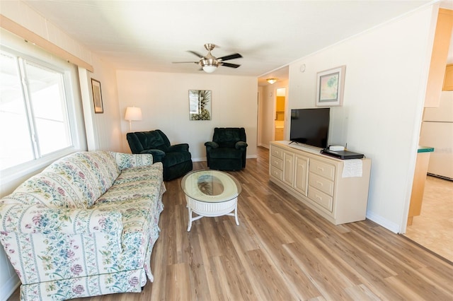 643 Blackburn Blvd, North Port, FL 34287 - living room featuring light wood-style flooring, a ceiling fan, and baseboards