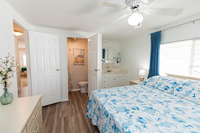 643 Blackburn Blvd, North Port, FL 34287 - bedroom with ensuite bathroom, dark wood-style flooring, and a ceiling fan