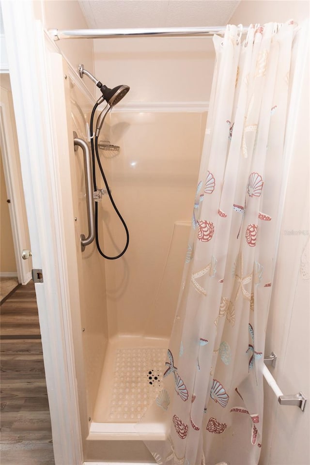 643 Blackburn Blvd, North Port, FL 34287 - full bath featuring a stall shower and wood finished floors