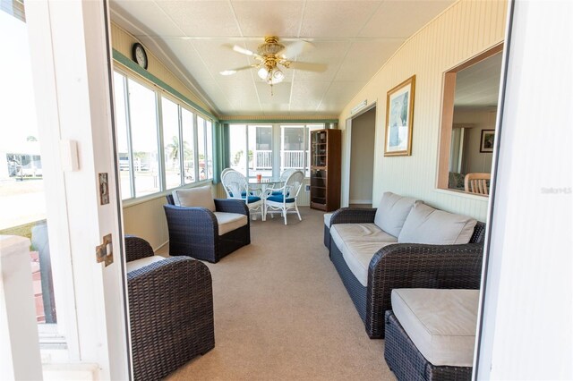 643 Blackburn Blvd, North Port, FL 34287 - sunroom featuring ceiling fan, carpet, and an outdoor hangout area