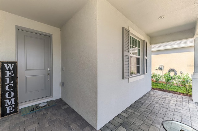 10995 Pinot Dr, Venice, FL 34293 - entrance to property featuring stucco siding
