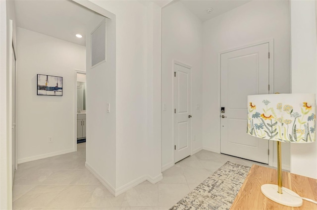 10995 Pinot Dr, Venice, FL 34293 - entryway with baseboards, recessed lighting, light tile patterned floors, and visible vents