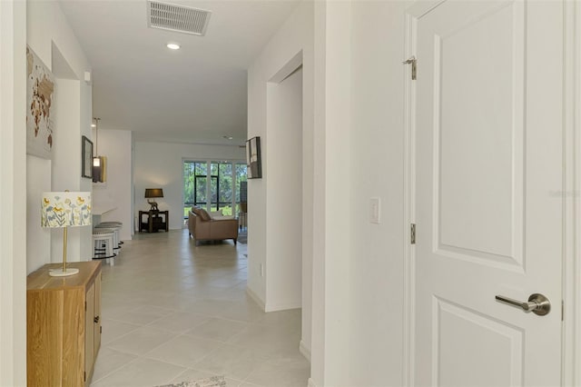 10995 Pinot Dr, Venice, FL 34293 - hallway featuring light tile patterned floors, baseboards, and visible vents