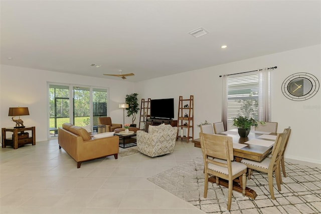 10995 Pinot Dr, Venice, FL 34293 - living room featuring light tile patterned floors, recessed lighting, visible vents, and plenty of natural light