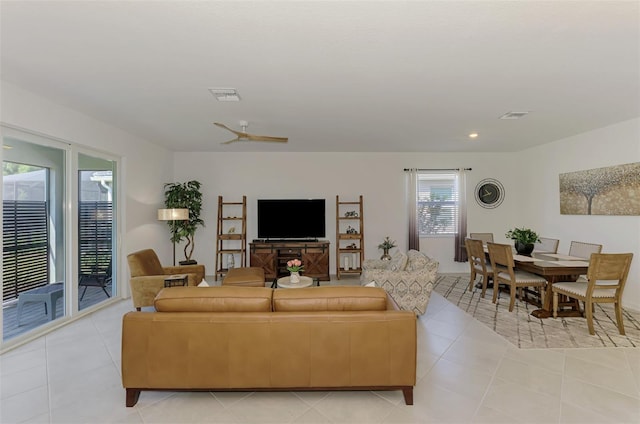10995 Pinot Dr, Venice, FL 34293 - living area featuring a ceiling fan, light tile patterned floors, and visible vents