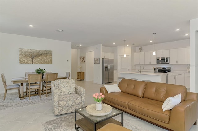 10995 Pinot Dr, Venice, FL 34293 - living room featuring light tile patterned floors, visible vents, and recessed lighting