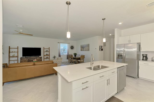 10995 Pinot Dr, Venice, FL 34293 - kitchen with a sink, light tile patterned flooring, visible vents, light countertops, and appliances with stainless steel finishes
