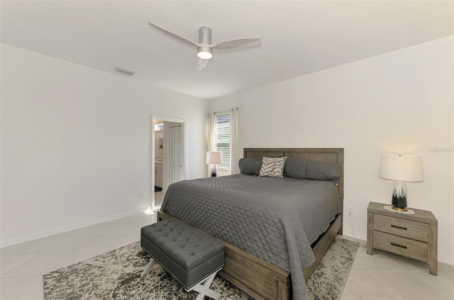 10995 Pinot Dr, Venice, FL 34293 - bedroom featuring ensuite bath, visible vents, a ceiling fan, light tile patterned floors, and baseboards