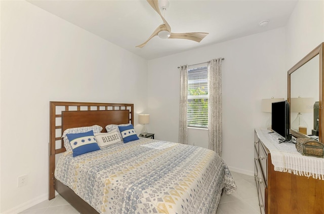 10995 Pinot Dr, Venice, FL 34293 - bedroom with light tile patterned floors, baseboards, and ceiling fan
