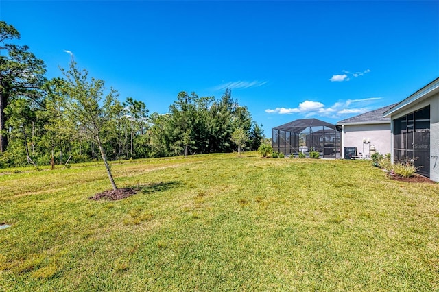 10995 Pinot Dr, Venice, FL 34293 - view of yard featuring a lanai