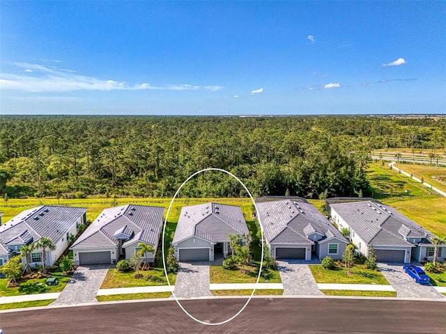 10995 Pinot Dr, Venice, FL 34293 - drone / aerial view featuring a residential view and a view of trees