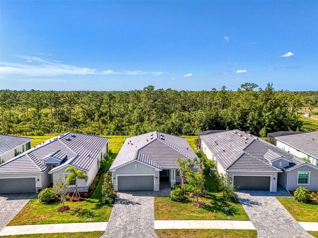 10995 Pinot Dr, Venice, FL 34293 - birds eye view of property with a forest view