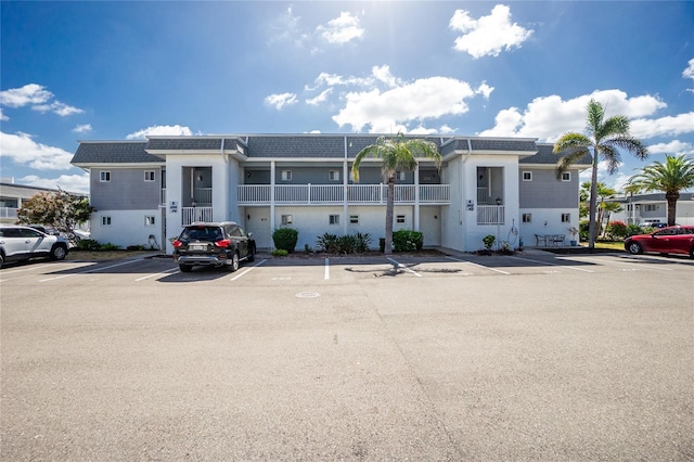 22375 Edgewater Dr Unit 123, Punta Gorda, FL 33980 - view of building exterior with uncovered parking
