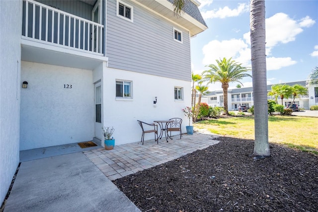 22375 Edgewater Dr Unit 123, Punta Gorda, FL 33980 - exterior space with stucco siding and a patio