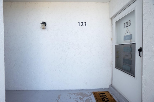 22375 Edgewater Dr Unit 123, Punta Gorda, FL 33980 - doorway to property with stucco siding